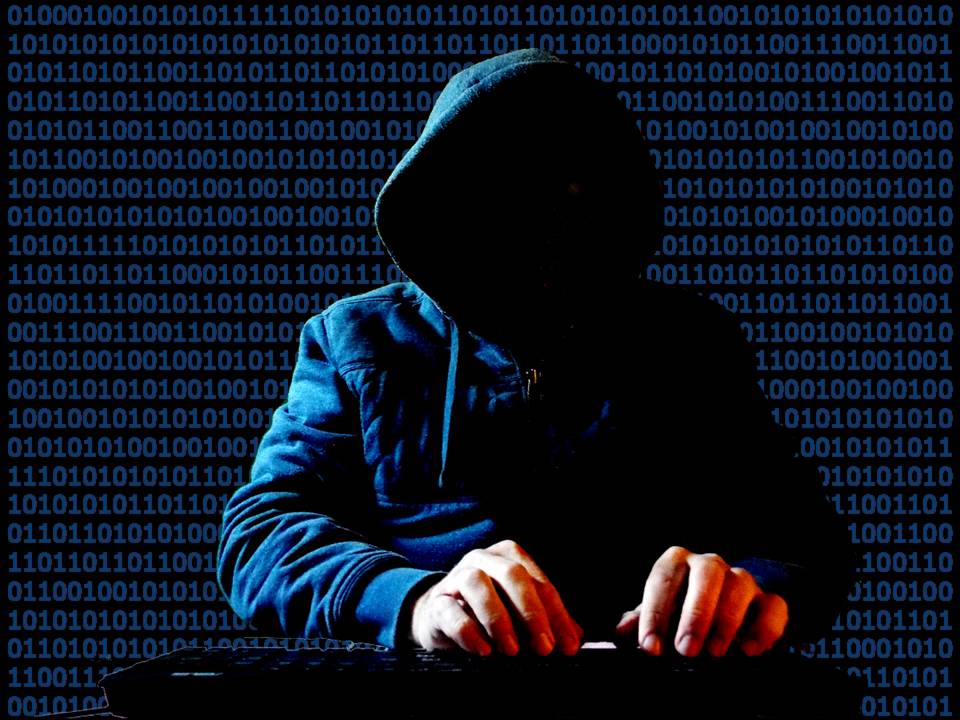 一张概念图片，展示了一位网络黑客在使用计算机